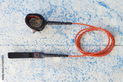 New strong orange surfboard leash. photo