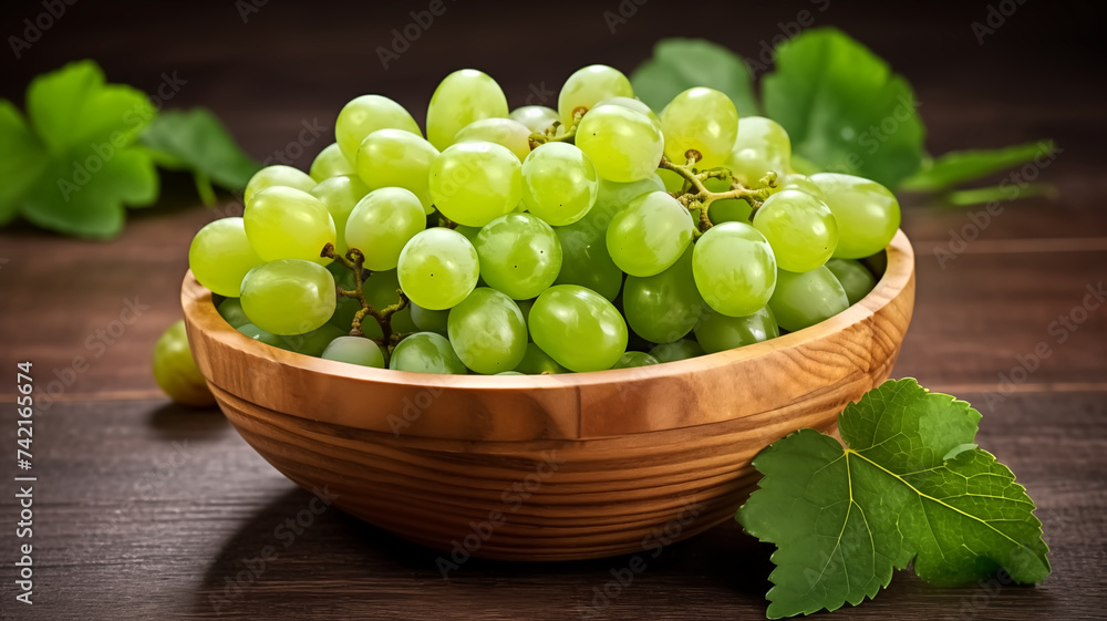 Fresh Shine Muscat grape in a wooden bowl. Juicy and fresh Shine Muscat grape with green leaves on a rustic table. Concept Shine Muscat grape antioxidant for healthy eating and nutrition. Fresh Shine Muscat grape in a wooden bowl. Juicy and fresh Shine Muscat grape with green leaves on a rustic table. Concept Shine Muscat grape antioxidant for healthy eating and nutrition.