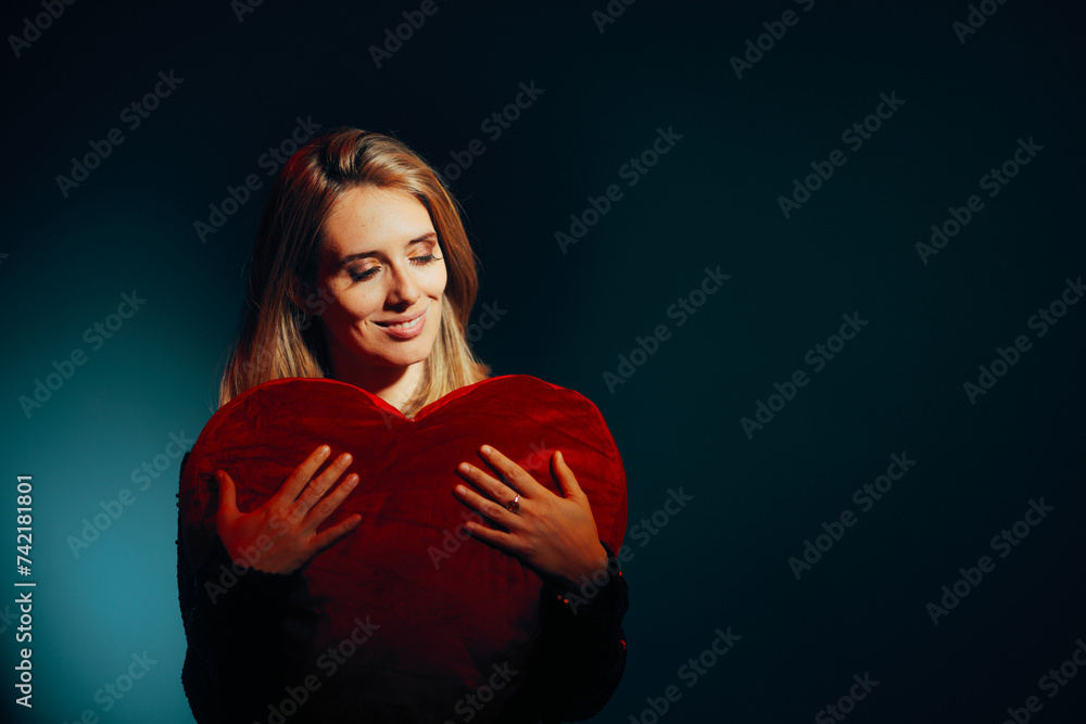 Beautiful Woman Holding a Heart-Shaped Pillow Feeling Grateful. Caring affectionate person presenting a love symbol
Beautiful Woman Holding a Heart-Shaped Pillow Feeling Grateful. Caring affectionate person presenting a love symbol