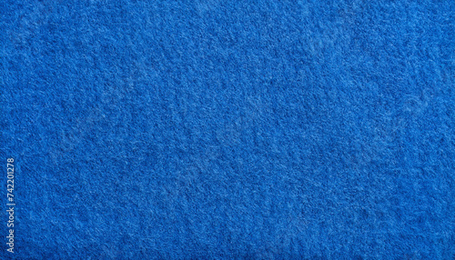 blue felt fabric texture as background. melange fuzzy woolen cloth textured; close up of textile surface photo