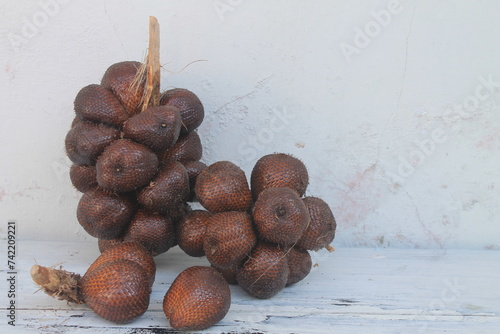 A bunch of salak pondoh on the table

 photo