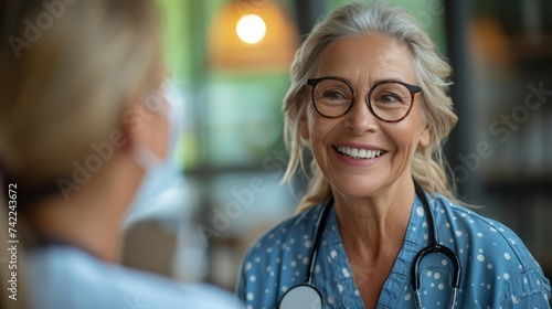 With a gentle smile an audiologist explains the results of a hearing test to a senior offering suggestions for improving auditory health and maintaining a fulfilling retirement. photo