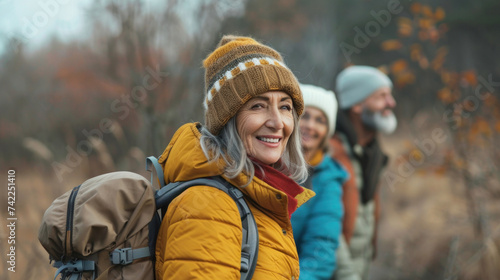 Portrait cheerful smiling middle age woman hiking walking with her husband enjoying free time and nature. Active beautiful seniors in love together at winter day #742251410