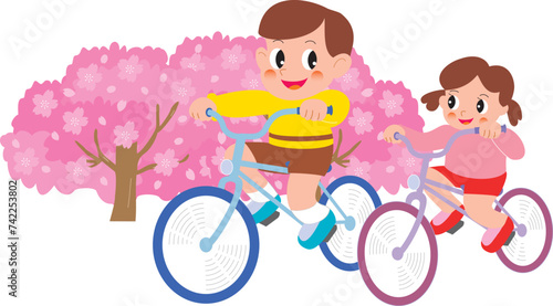 桜と自転車に乗る男の子と女の子
