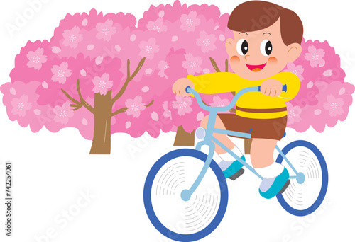 桜と自転車に乗る男の子
