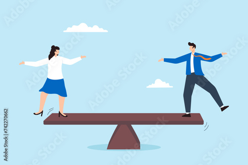 Businessman and businesswoman balancing on equal seesaw