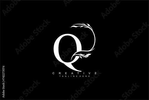 luxury white letter Q logo design with beautiful flower and leaf ornaments. monogram Q, logo typography. initials Q. typography. for business logos, boutiques, companies, beauty, etc photo