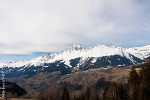 Ruchi mountain in the Glarus Alps, and village of Waltensburg/Vuorz in Graubünden, Switzerland photo