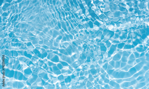 Blue water surface texture with ripples, splashes, and bubbles. Abstract summer banner background Water waves in sunlight with copy space cosmetic moisturizer micellar toner emulsion. Blue water wave.