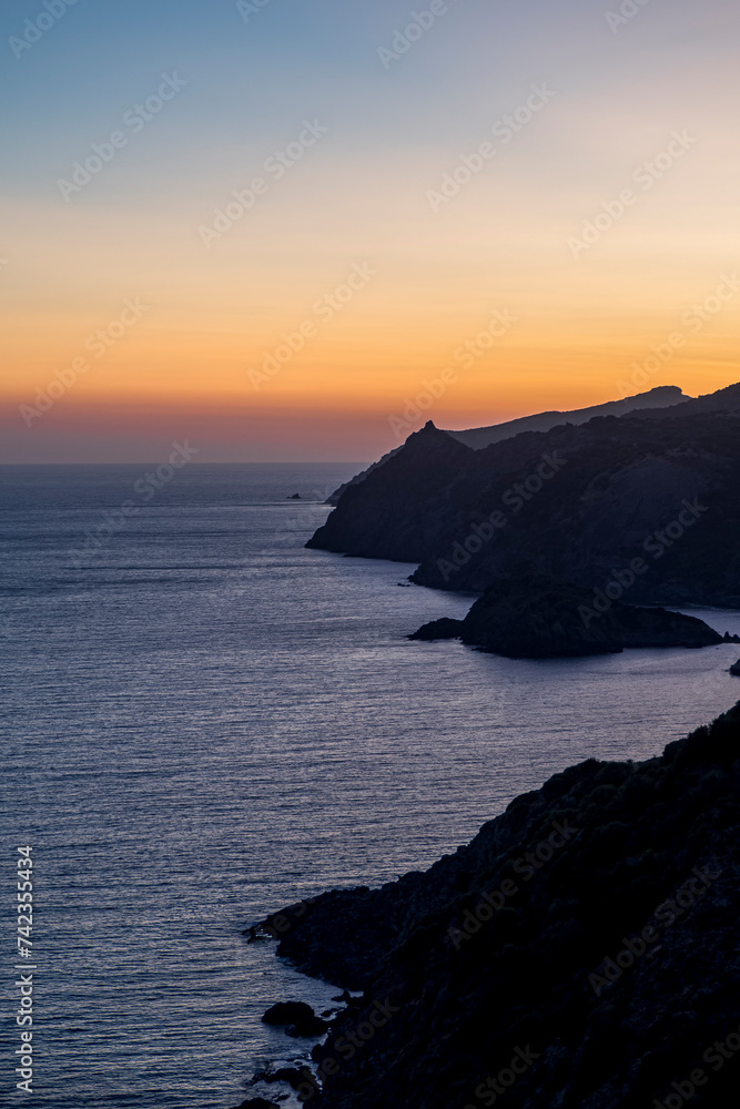 rugged coast of Sardinia, Italy near Bosa at sunset or twilight travel and tourism