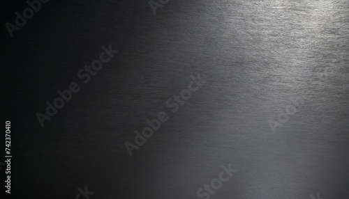 Brushed metal texture, shadow on lower left. dark background with copy space