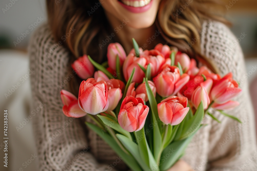 Joyful woman holding bouquet of pink tulips. Spring and happiness. Joyful woman holding bouquet of pink tulips. Spring and happiness.