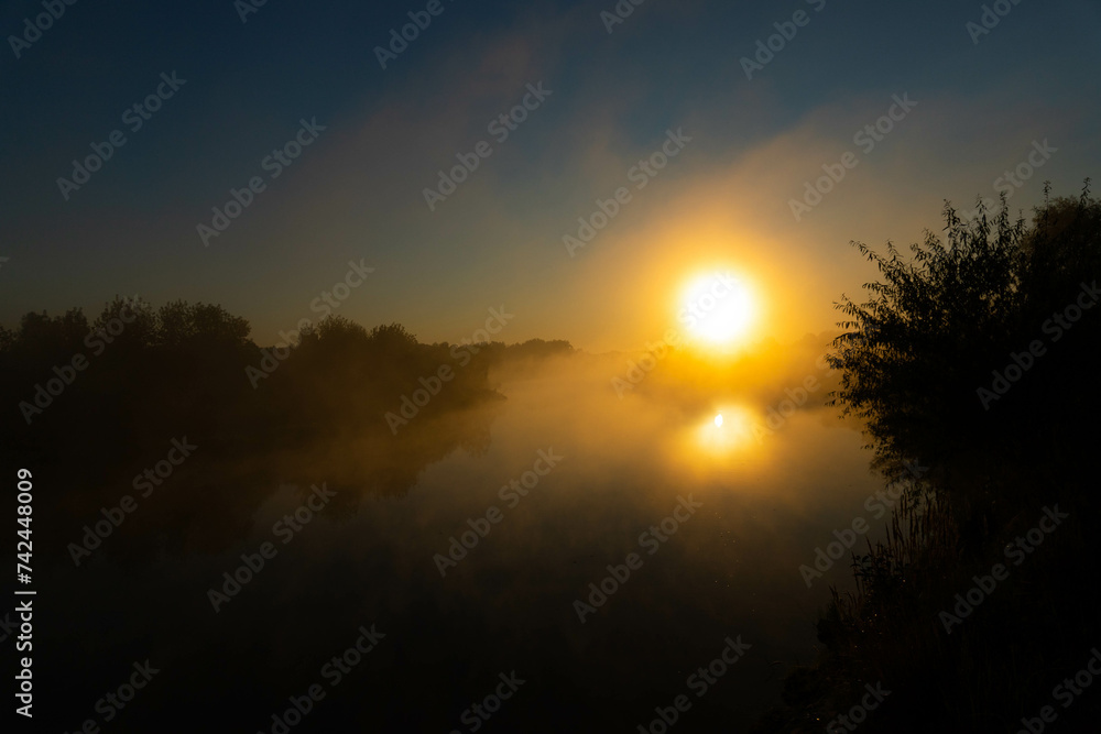 Panorama of beautiful misty lake coast at sunrise moment. Panorama of beautiful misty lake coast at sunrise moment.
