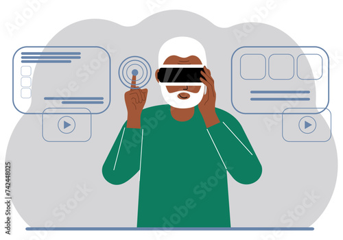 A man wearing a virtual reality headset studies, works, plays and works.