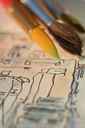 Watercolor brushes on the background of the picture. Shallow depth of field