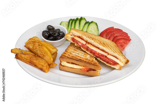 Toast with cheddar cheese, sausage and tomato with french fries and salad on white background photo