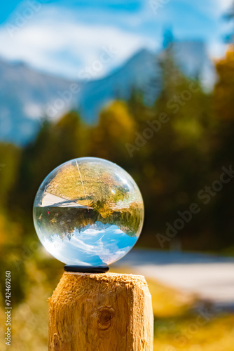 Crystal ball alpine autumn or indian summer landscape shot at Grosser Ahornboden, large maple grove, Hinterriss, Schwaz, Tyrol, Austria