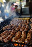 Juicy grilled sausages with fresh herbs on a hot BBQ grill, perfect for summer cookouts of summer and outdoor dining