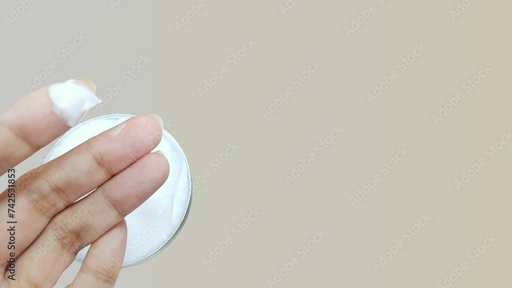 A palm of hand, apply cream, cream on a hand, on a finger, for smooth skin, and beauty background A palm of hand, apply cream, cream on a hand, on a finger, for smooth skin, and beauty background