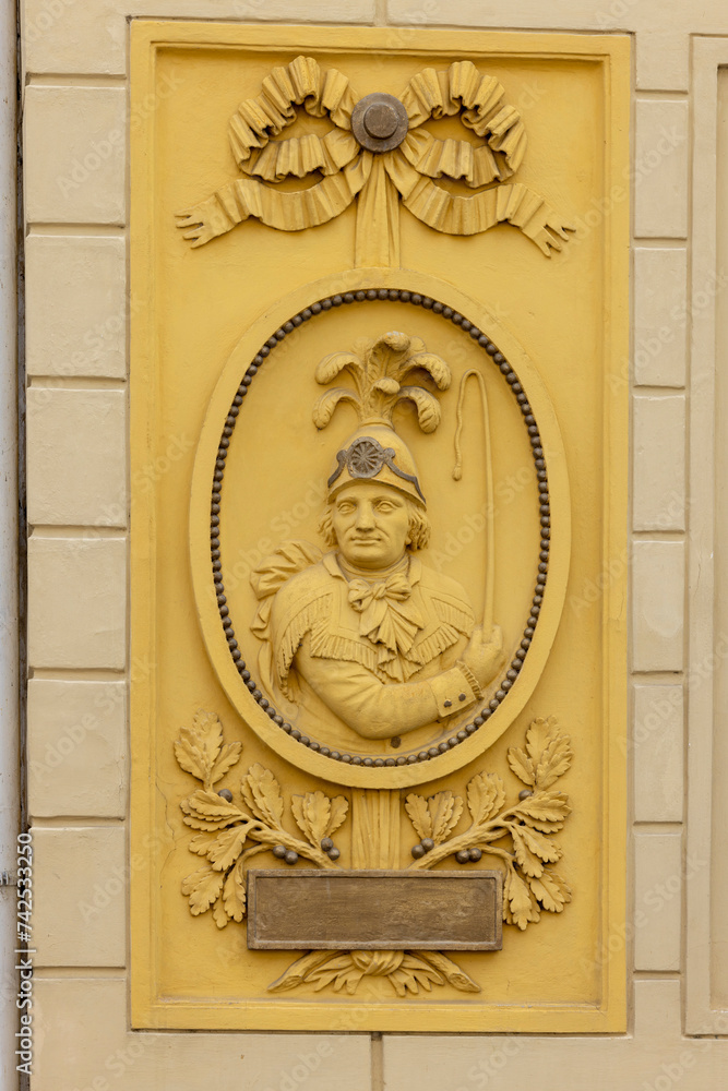 Relief on fasade of former post office (altes posthaus) near to market square, Melk, Austria