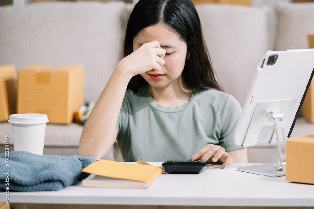 Stress businesswoman is sitting at table, under stress from working business online seller. Stress businesswoman is sitting at table, under stress from working business online seller.