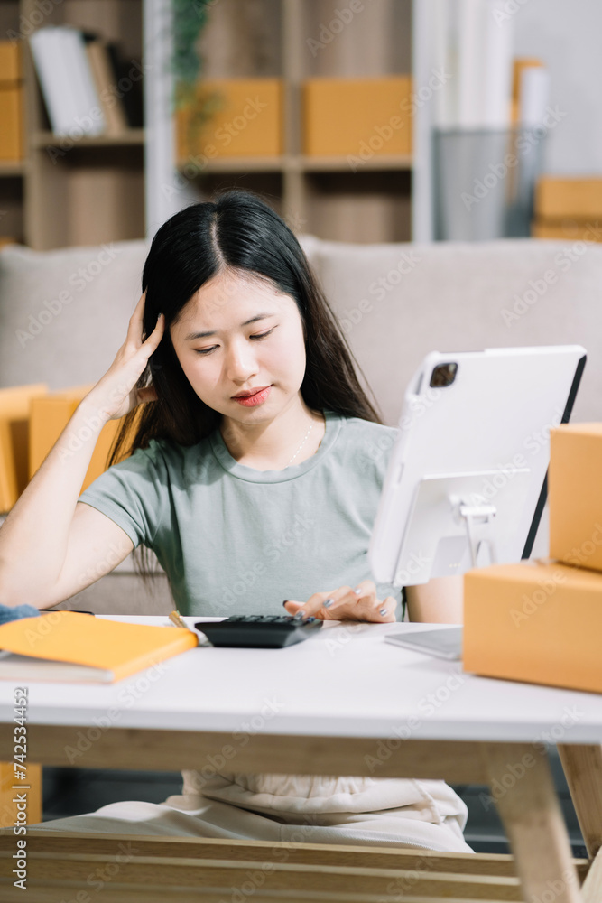 Stress businesswoman is sitting at table, under stress from working business online seller. Stress businesswoman is sitting at table, under stress from working business online seller.