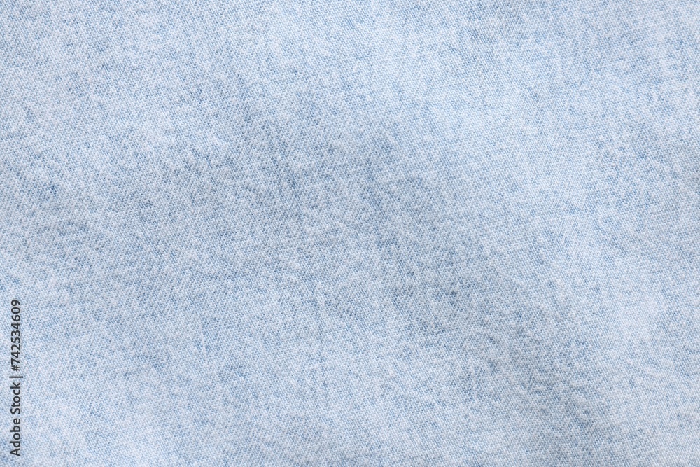 Naklejka premium Texture of light blue fabric as background, top view