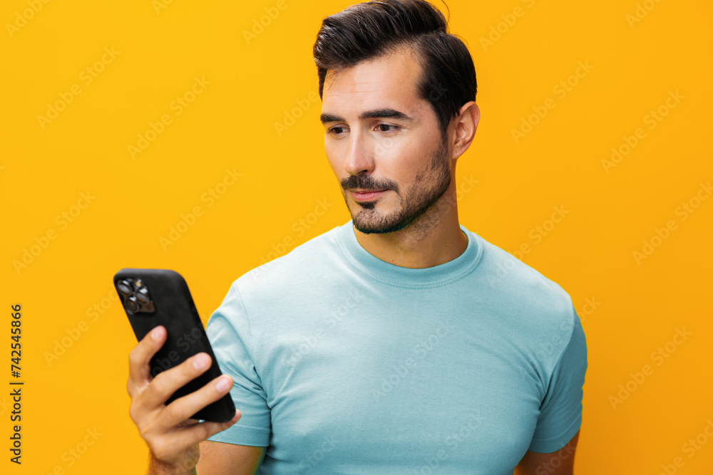 Phone man portrait happy studio smartphone space smiling phone yellow technology communication cyberspace mobile copy Phone man portrait happy studio smartphone space smiling phone yellow technology communication cyberspace mobile copy