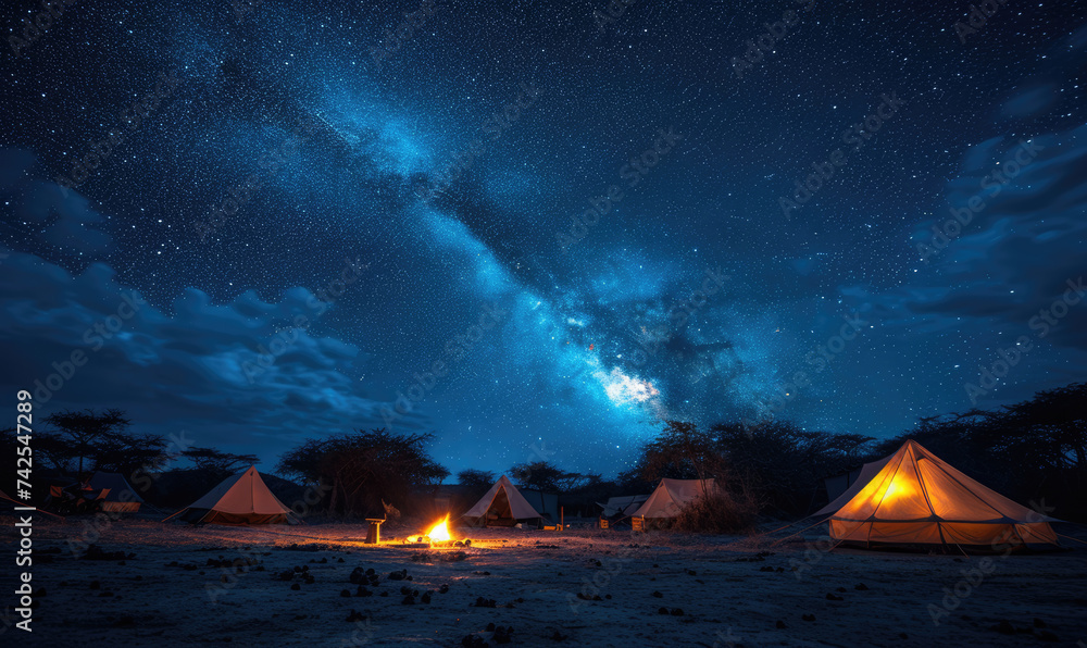 Camping under the Serengeti Stars: Capture the Magic of a Starry Night Sky Blanketing the Campsite, Where Adventure and Nature Unite in Perfect Harmony.