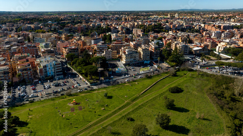 Aerial view on the houses and buildings of Primavalle district in Rome, Italy. In foreground there is Pineto Park.
