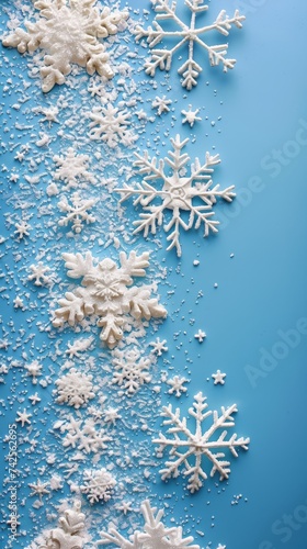 Whimsical snowflakes on blue upper right text space