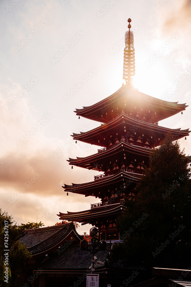 Sunset view of the five-storey pagoda devoted to Kannon Bosatsu, the Goddess of Mercy, at Senso-ji temple in Asakusa, Tokyo, Japan.