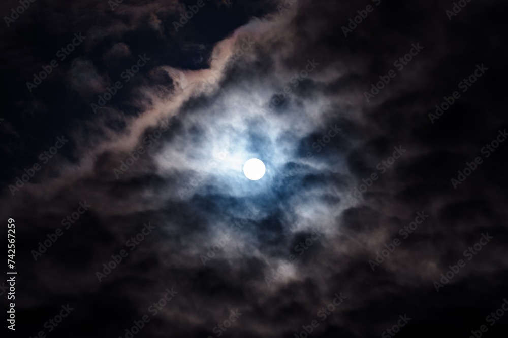 The midday sun between clouds The midday sun between clouds