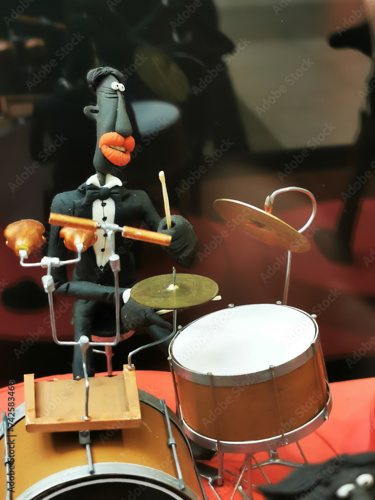 Fototapeta premium a doll playing musical instrument