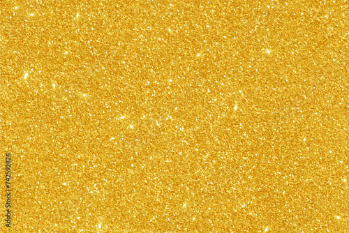Golden yellow glitter bokeh background. Photo can be used for New Year, Christmas and all celebration concepts. 