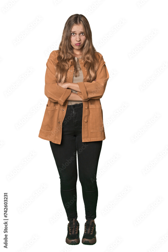 Studio portrait of a blonde Caucasian woman unhappy looking in camera with sarcastic expression. Studio portrait of a blonde Caucasian woman unhappy looking in camera with sarcastic expression.