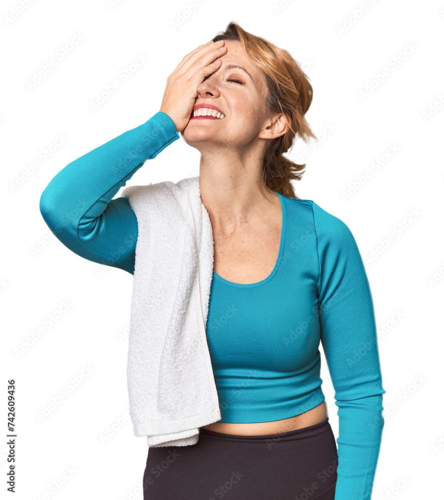 Caucasian woman in sportswear with towel laughing happy, carefree, natural emotion. Caucasian woman in sportswear with towel laughing happy, carefree, natural emotion.