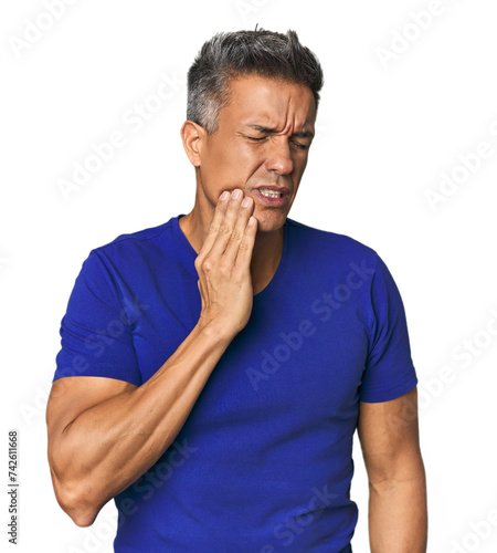 Middle-aged Latino man having a strong teeth pain  molar ache.