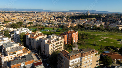 Aerial view of Prati neighborhood in Rome, Italy. In the background there is the dome of St. Peter's Basilica in Vatican City. In the foreground there is Monte Ciocci and Ettore Scola park. photo