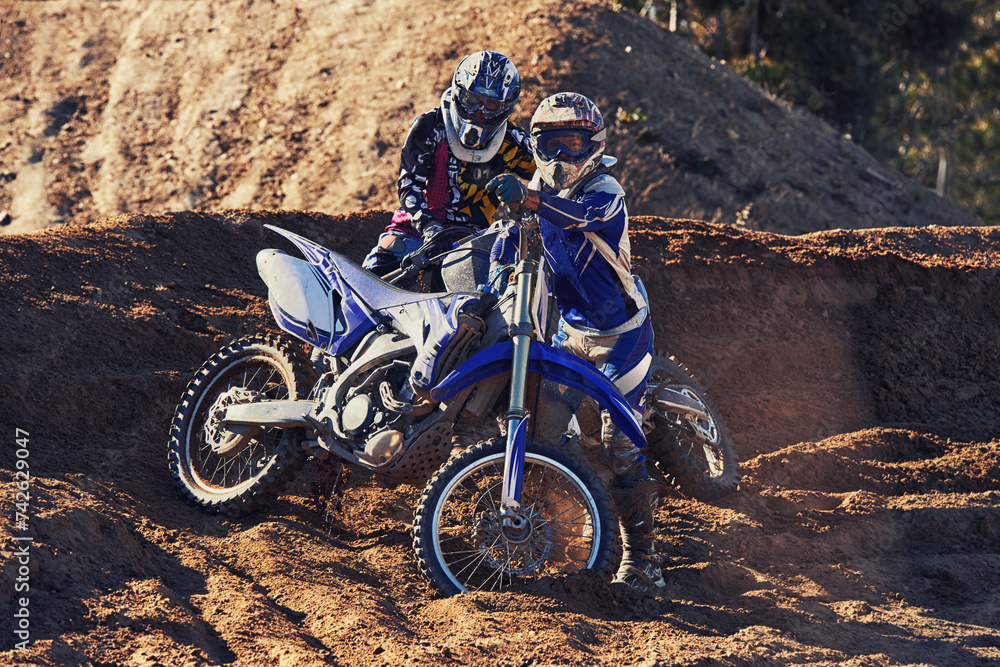 People, motorbike and outdoor by rocks on dirt path with adventure, transportation and extreme sports. Racer, rider and motorcycle with helmet for safety with portrait, course and gravel in nature People, motorbike and outdoor by rocks on dirt path with adventure, transportation and extreme sports. Racer, rider and motorcycle with helmet for safety with portrait, course and gravel in nature