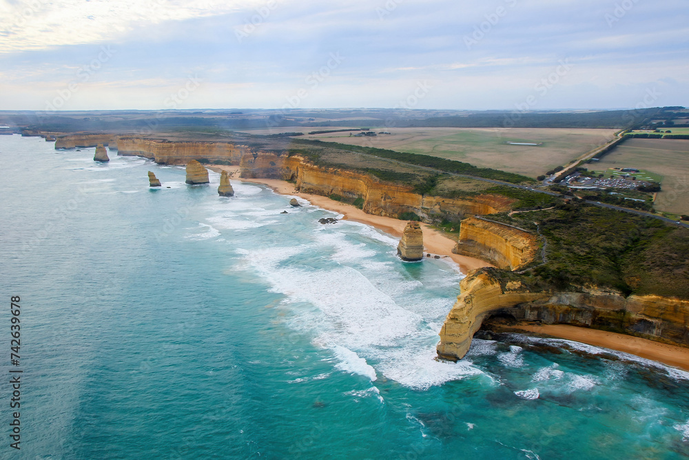 Fototapeta premium Aerial view of the Australian coastline at the Twelve Apostles in the Port Campbell National Park - Collection of limestone stacks in the Tasman Sea off the coast of Victoria, Australia