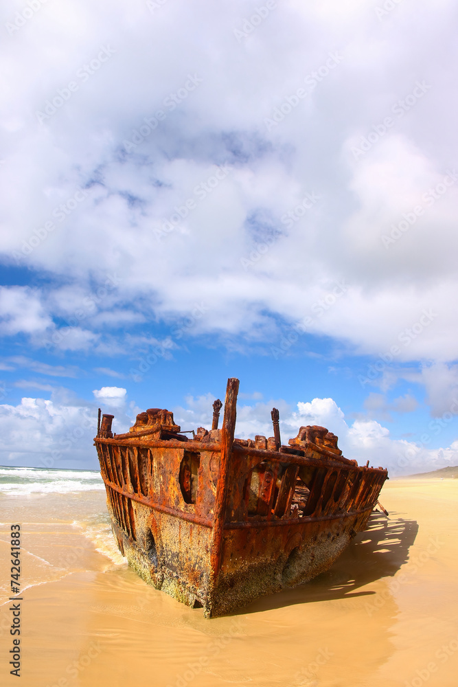 SS Maheno shipwreck half buried in the sand of the 75 mile beach on the east coast of Fraser Island in Queensland, Australia - It washed ashore during a cyclone in 1935 when on route from New Zealand