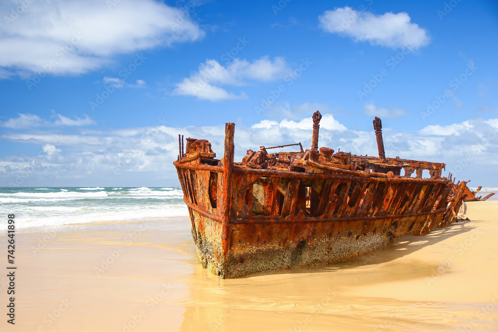 SS Maheno shipwreck half buried in the sand of the 75 mile beach on the east coast of Fraser Island in Queensland, Australia - It washed ashore during a cyclone in 1935 when on route from New Zealand