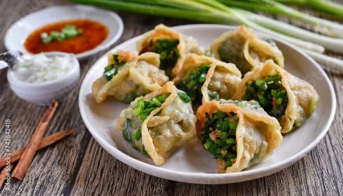 deep fried chinese chive dumplings kanom gui chai or ku chai kuih make for a great healthy and light snack appetizer and consisting of chinese chives stuffed inside dumpling dough