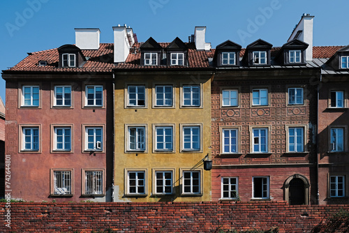 The medieval city wall and amazing old facade buildings in the Old Town of Warsaw, capital of Poland