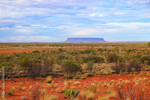 Mount Conner aka Fooluru in the desert plains of the Red Center of Australia in the Northern Territory - Flat inselberg made of sandstone by erosion, called Attila or Attila by the natives photo