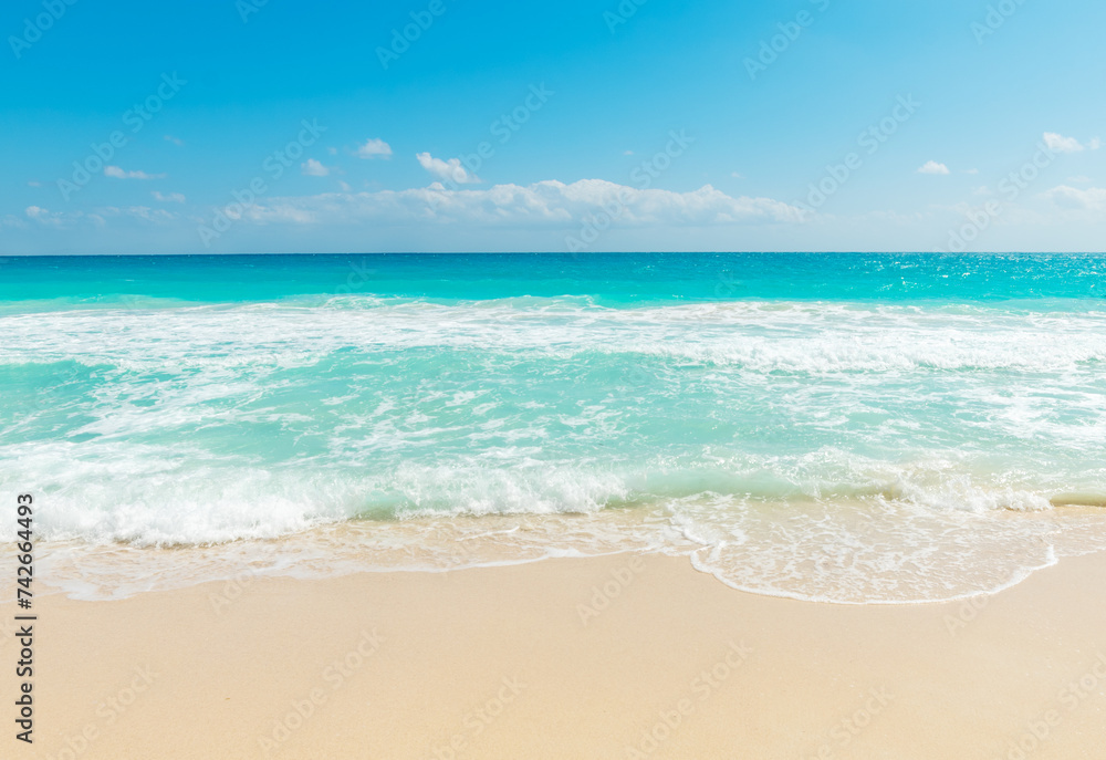 Turquoise water and golden sand in a tropical beach