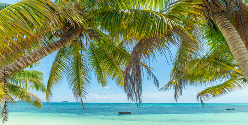 Wooden boat in a tropical beach shore