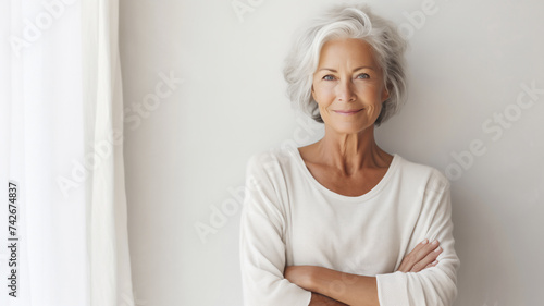 Elderly smiling woman on white background