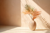 A vase with a with palm leaves stands on a table, providing a natural touch to a presentation
